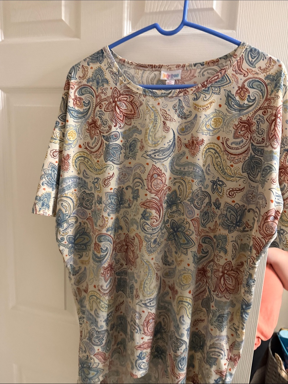 LuLaRoe Cream Paisley Short Sleeve Top with Blue, Red, Yellow Accents